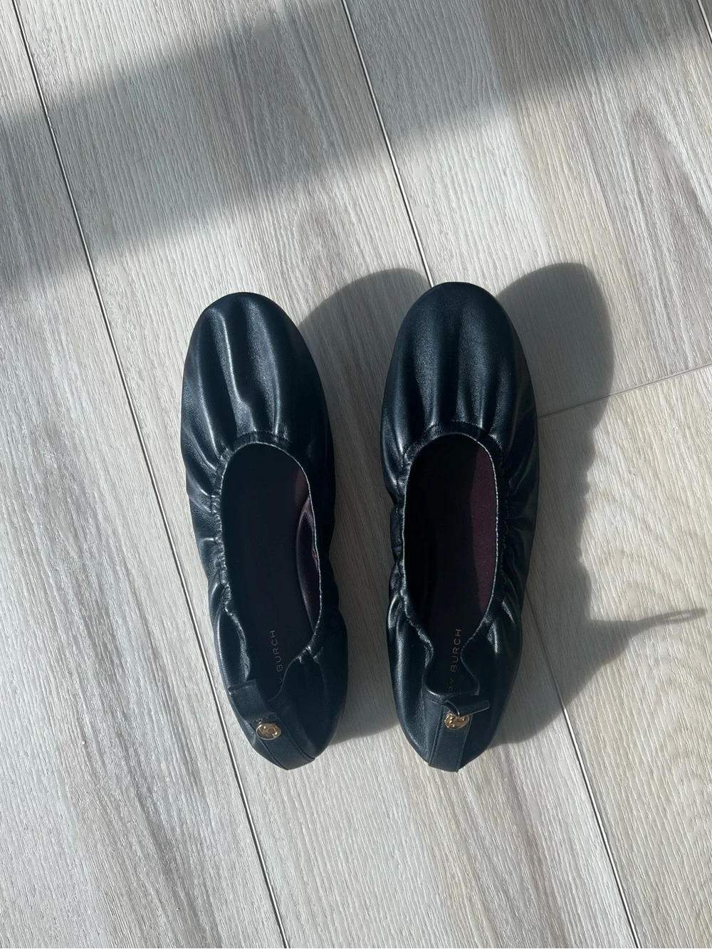 Tory Burch “Eddie” Black Ballet Flats with Gold Logo Button